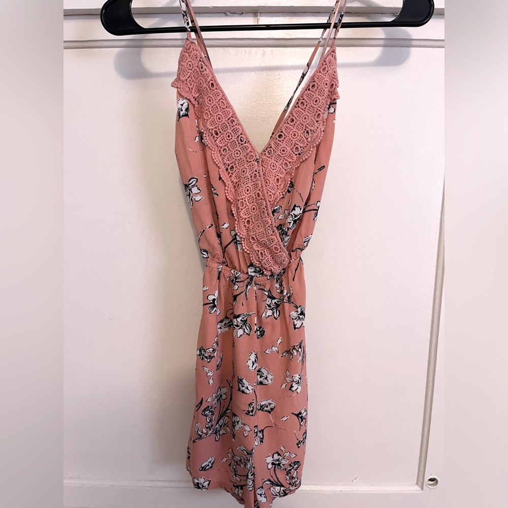 Pink floral romper with open strappy back. Size S